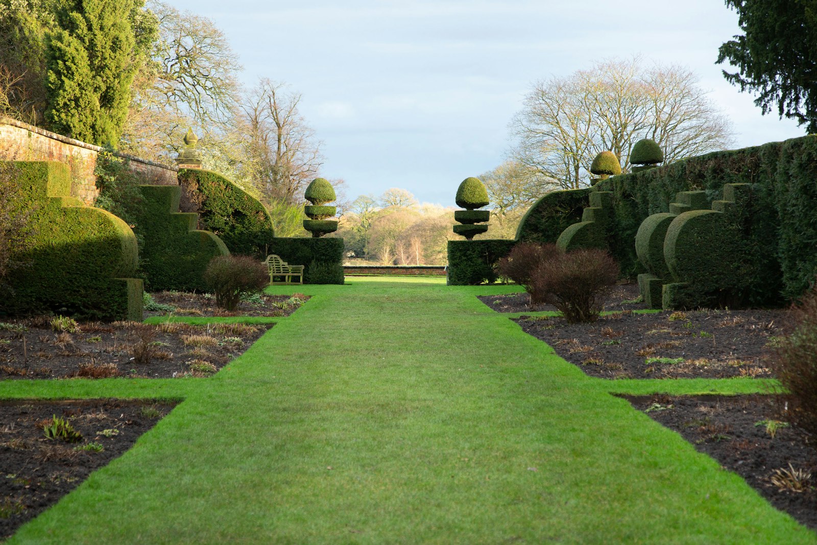 Large Garland back lawn with mature trees and a recently striped cut.
